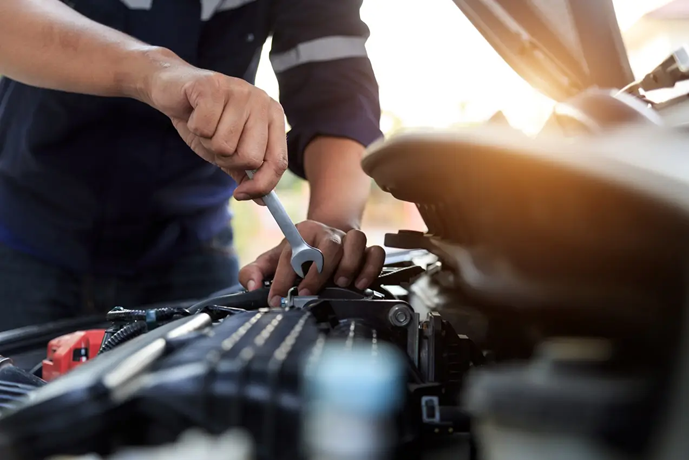 A mechanic completes maintenance on a car