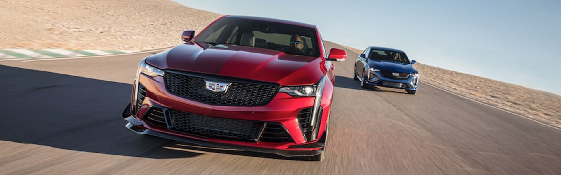 Two CT4 driving on highway